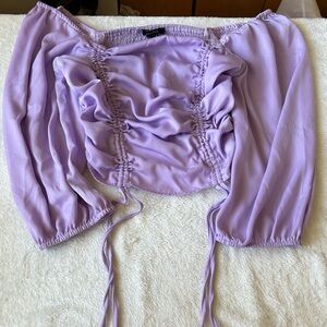 I am selling a lavender silk top from Rue21